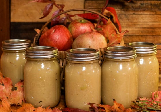 Thumbnail image of Glass,Jars,Of,Homemade,Applesauce,On,A,Wooden,Board,With