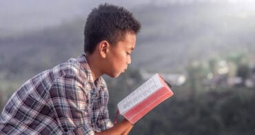Child reads religious text