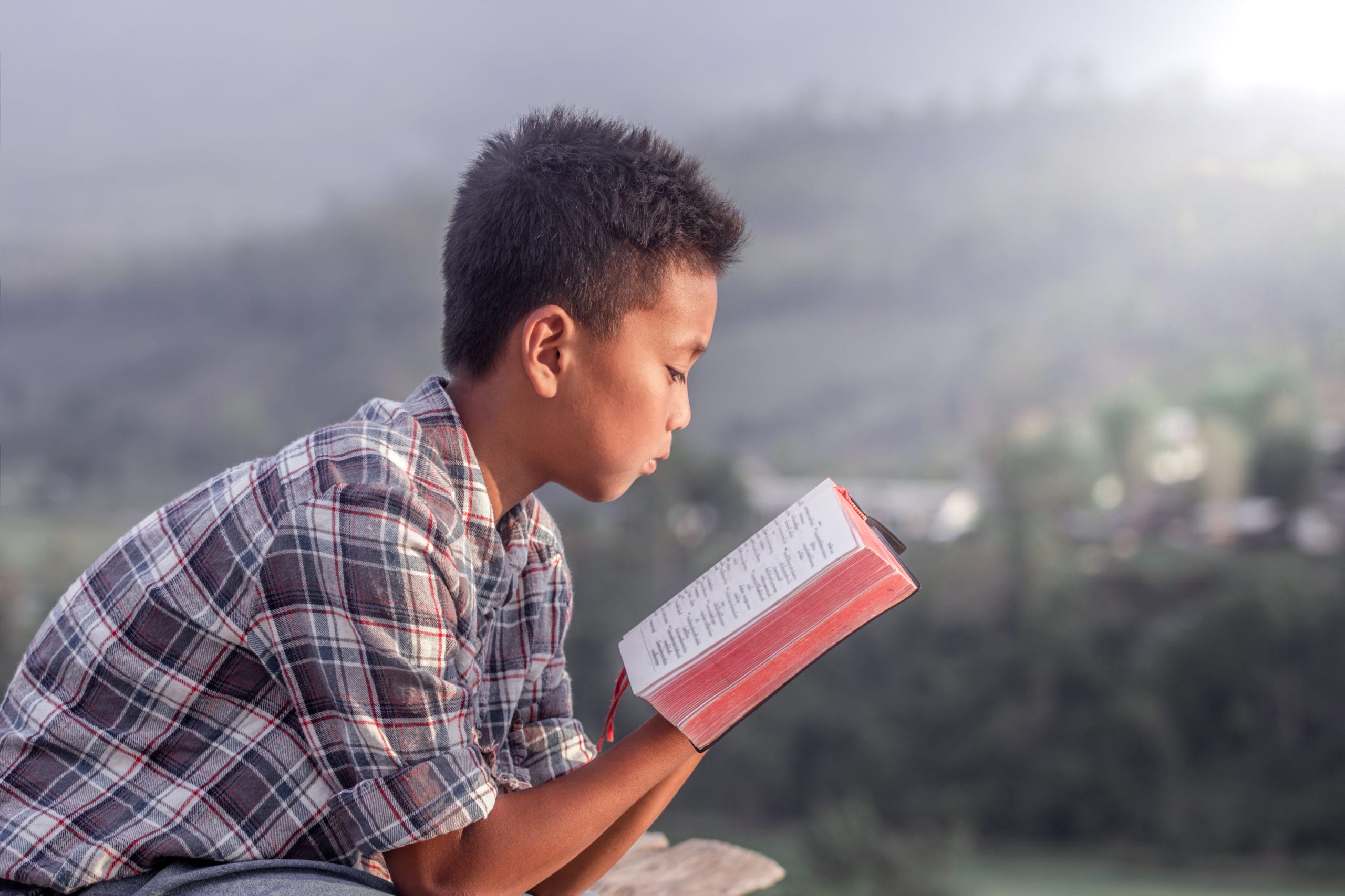 Child reads religious text
