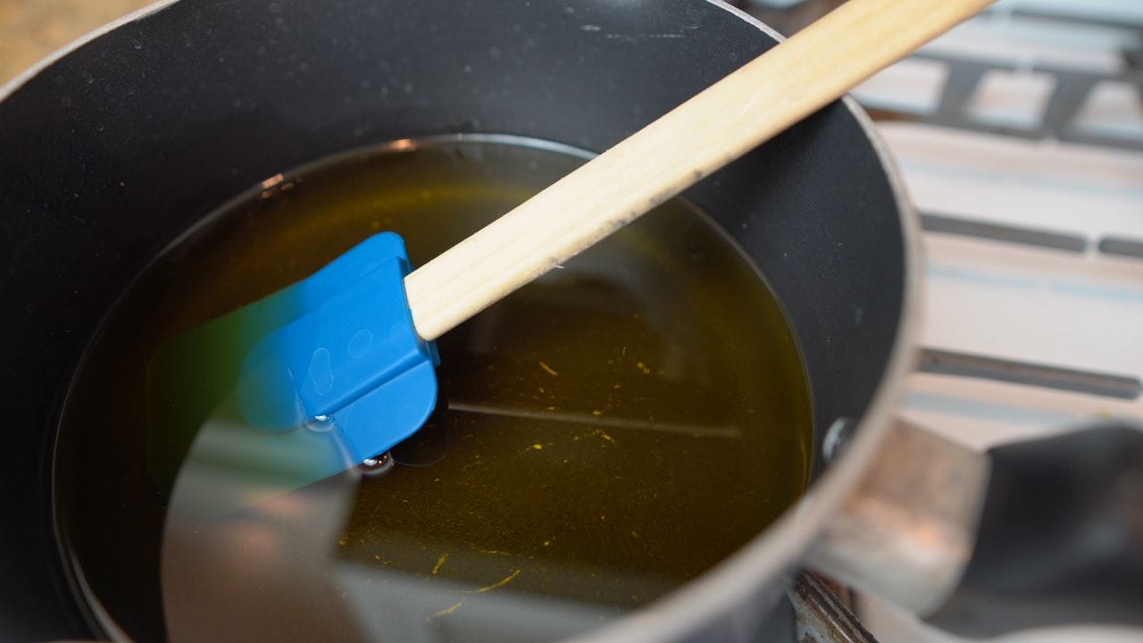 Warming solid fats for soap making