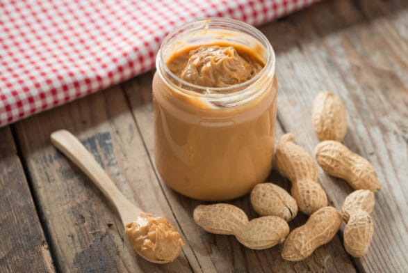 Thumbnail image of Creamy,And,Smooth,Peanut,Butter,In,Jar,On,Wood,Table.